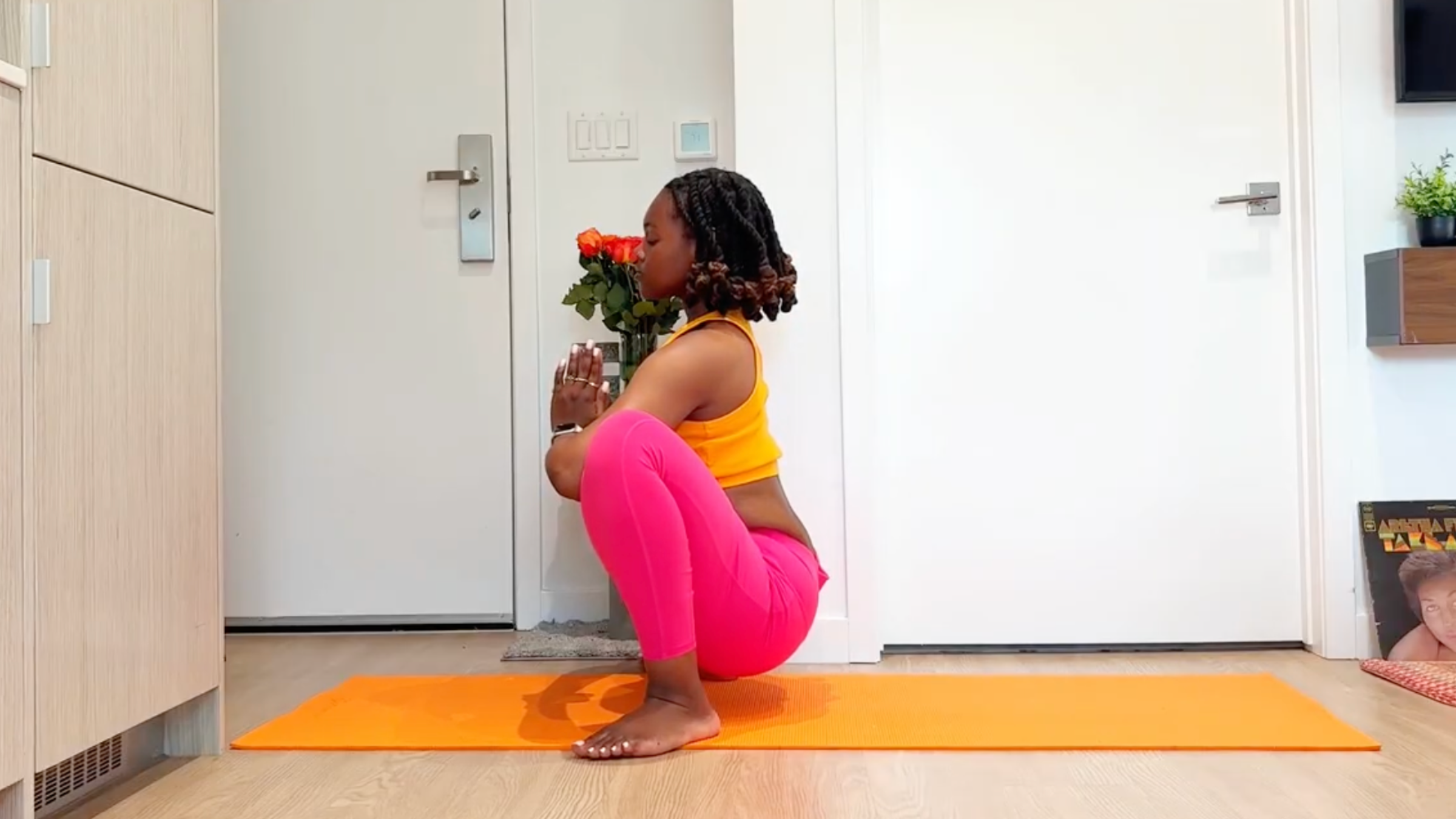 Yoga teacher practicing Squat